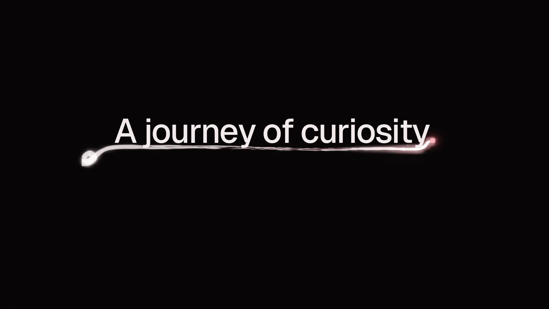 A single ember of light on black, and behind it a line of ink-light that underlines the words A journey of curiosity.